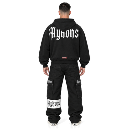 [400] Signature ZIP on model, straight back, updated AYKONS back graphic, black Signature cargos, white background