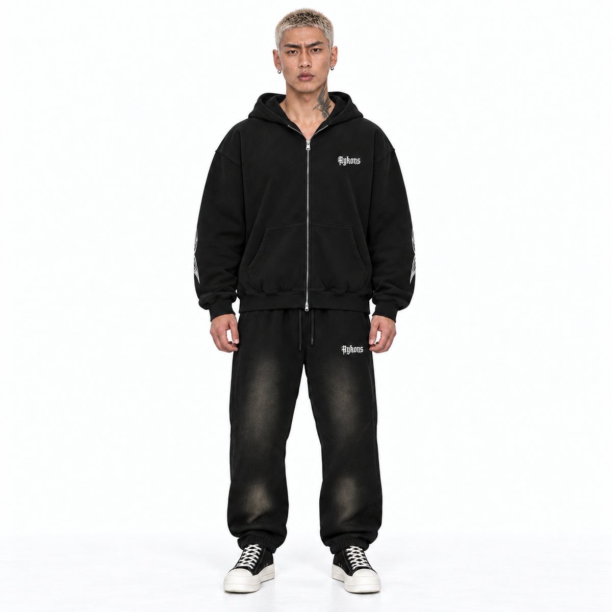 Experience Zip hoodie in black – model straight front, wearing Smoky Black OAHR sweats and black and white Rick Owens Converse high tops on a white background.
