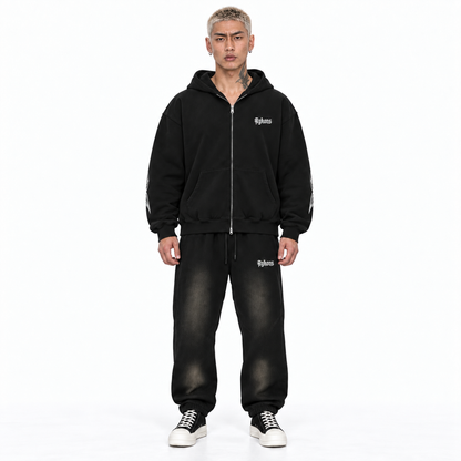 Experience Zip hoodie in black – model straight front, wearing Smoky Black OAHR sweats and black and white Rick Owens Converse high tops on a white background.