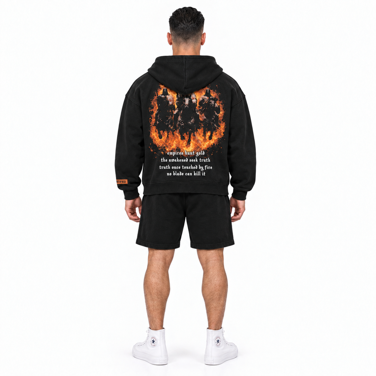 AYKONS [400] Solomon's Secrets Zip hoodie in black and orange - Model 1 straight back full-body shot with matching orange embroidered CERTIFIED shorts and all-white high-top Converse.