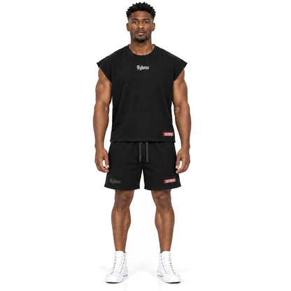 Black Anointed Cutoff — model straight front, wearing black and maroon Certified shorts and white leather Converse high-tops on a pure white background.