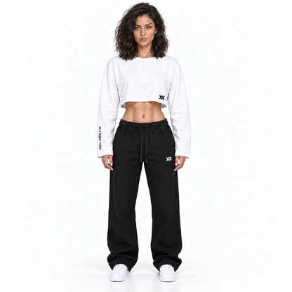 White and black AYKONS Racer Crop — Women Model 1 front view with black AYKONS sweatpants